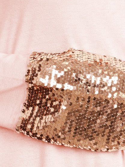 Blusa con mangas largas y puños con lentejuelas brillantes